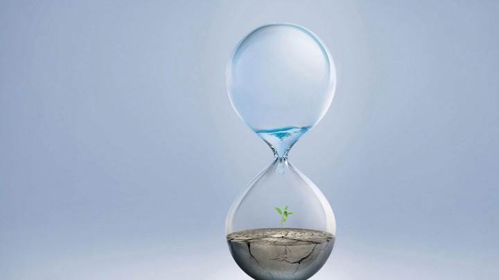 Hourglass And Light Blue Background